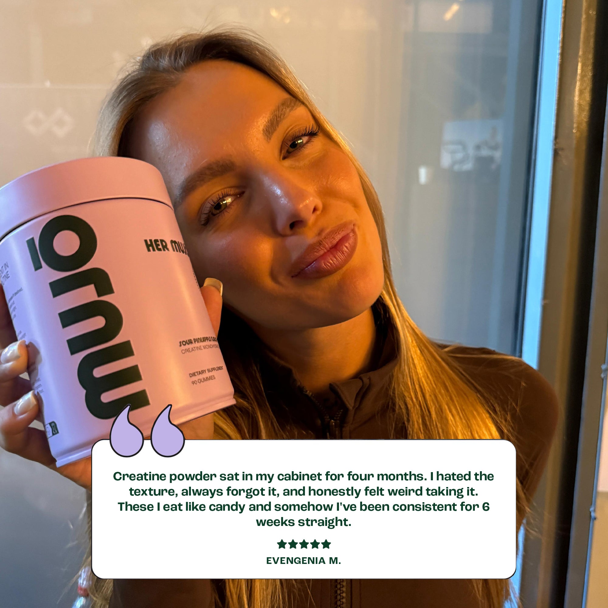 Person holding a pink supplement container with a review overlay.